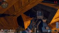 Location of the headphone under the conservatory staircase (Image via Activision)